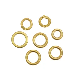 Seven unique gold plated sand gold ring charms including smooth, twisted, and dragon patterns