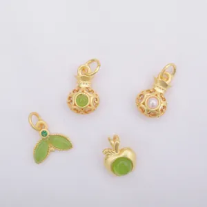 Sand gold charms set featuring lucky bag, apple, and leaf designs with green gems