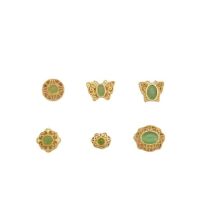 Ancient gold clover and butterfly spacer beads with green gemstones for jewelry making