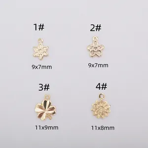 14K gold plated floral pendants in clover and daisy shapes for DIY jewelry making