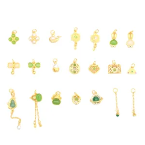 Golden jewelry charms set with green faux jade and pearls for DIY bracelets