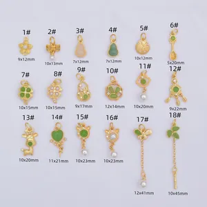 Set of 18 golden sand gold pendants featuring clovers, bunnies, and bows on white background