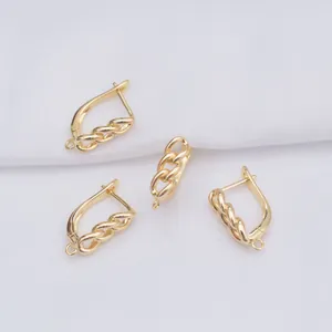 Macro shot of 14k gold-filled U-shape earring hooks with textured chain detail for DIY