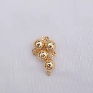Macro detail of 14k gold-plated magnetic ball clasps for DIY jewelry making