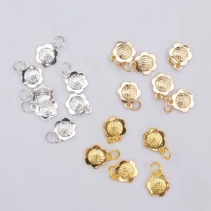 Detail of 14k gold flower charms with Fu character engraving for DIY jewelry