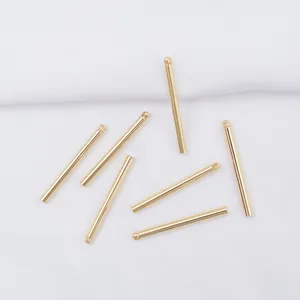 Detailed view of 14k gold-plated cylinder bar connectors for DIY jewelry making earrings