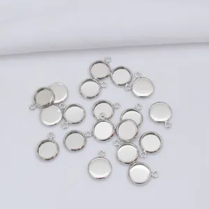 Macro shot of silver-plated round cabochon bezel settings for DIY jewelry making