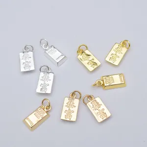 Pendentifs bijoux avec lingots d'or et breloques de richesse en finitions métalliques