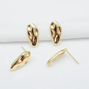 Detailed view of hammered 14k gold-filled earring studs with hanging loops for DIY crafts