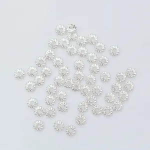 Bright silver twisted metal spacer beads for DIY jewelry making with floral texture