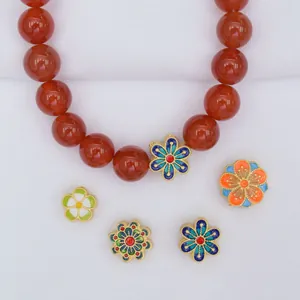 Traditional gold-plated red bead necklace with colorful floral enamel spacers and charms
