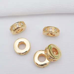 Macro view of 14K gold plated brass spacer beads with cubic zirconia for DIY jewelry