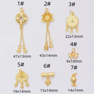 Collection of matte gold-plated Chinese pendants including lotus, bamboo, and koi charms