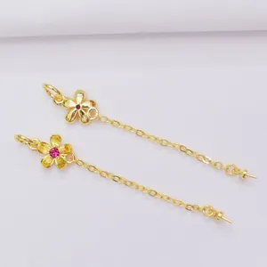 18k vergulde bloem hangers met rode edelstenen en elegante ketting kwastjes
