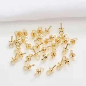 Detail of 14K gold filled pearl cup peg bails for DIY jewelry making and pendant crafting
