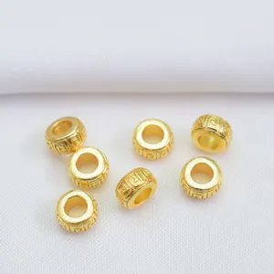 Detailed view of 18k gold plated Greek pattern spacer beads for DIY jewelry making