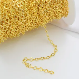 Macro shot of 14k gold-filled DIY chain with textured heart links for jewelry making