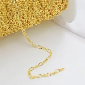 Detailed macro view of 14k gold-filled oval faceted link chain for DIY jewelry making