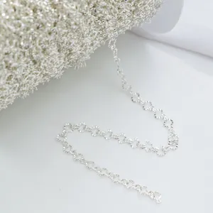 Detailed macro view of silver floral textured chain for DIY handmade jewelry crafts