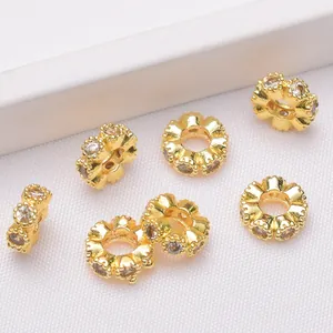 Detailed view of 14k gold plated spacer beads with embedded cubic zirconia for DIY jewelry