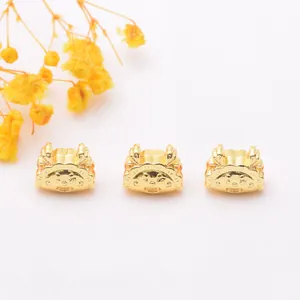 Detailed view of three 18k gold-plated hedgehog beads for DIY jewelry making and crafts