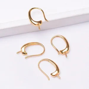 Detailed macro view of 14k gold plated DIY ear hooks with spiral pins for jewelry making