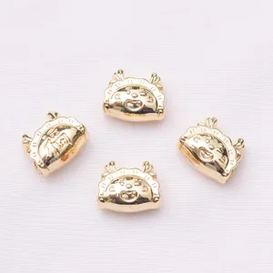 Detailed view of 18k gold plated dragon charms with Fu character for DIY jewelry