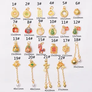 Golden Chinese traditional charms in various shapes like gourd and lotus pendants