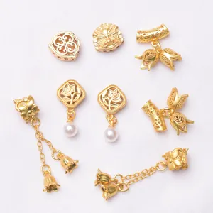 Exquisite gold-plated hollow spacer beads and diverse jewelry charms for DIY projects