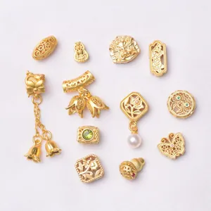 Detailed collection of gold plated DIY beads including butterfly and gourd pendants