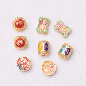 Assortiment de breloques en émail doré avec motifs chinois pour la création de bijoux