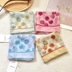 Polka dot cotton linen square scarf set in four vibrant colors with minimalist lifestyle props