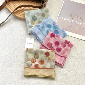 Set of four colorful polka dot cotton linen scarves in green, blue, pink, and orange