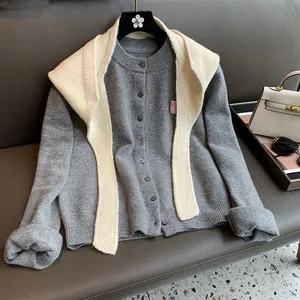 Dark gray knit cardigan set with white knit shawl and vintage button detail