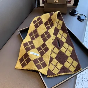 Knitted 100% wool scarf featuring a yellow and brown argyle pattern with a pull-through slot