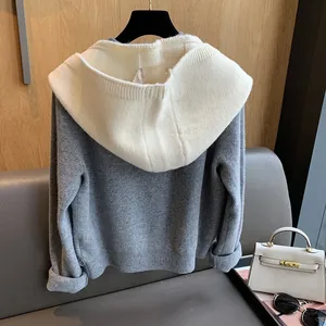 Detailed view of the soft knit texture and ribbed finish on the gray and white balaclava hood