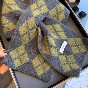 Detail of 100% pure wool scarf showing high-quality knit texture and diamond pattern
