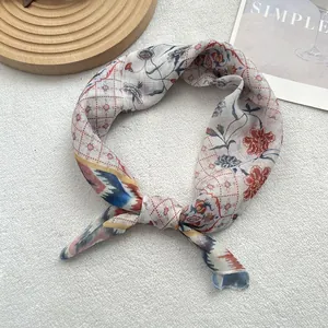 Detailed close-up of vintage floral cotton linen neckerchief with delicate hemmed edges