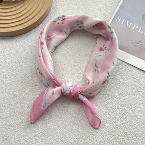 Pink floral cotton linen square scarf on white background with a minimalist magazine