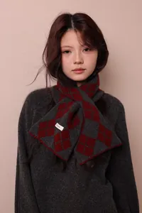 Detail of 100% pure wool scarf with grey and dark red argyle jacquard knit pattern