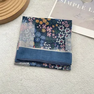 Close-up of floral cotton linen square scarf with detailed stitching and soft texture