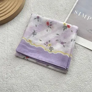 Close-up of lightweight floral cotton linen scarf with elegant purple floral patterns