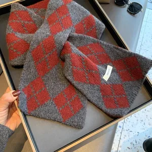 Macro detail of 100% pure wool argyle pattern scarf with premium knitted texture