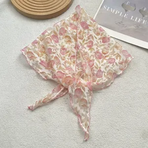 Close-up of pink tulip pattern on breathable linen cotton triangle scarf with wavy edges