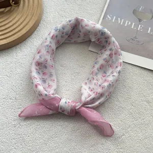 Detail of floral cotton linen scarf with fine overlock stitching and silky texture
