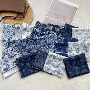 Blue and white floral lightweight silk square scarf set for women displayed on a tray