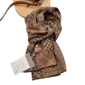 Retro brown cotton scarf with black rose floral print and Revival brand label