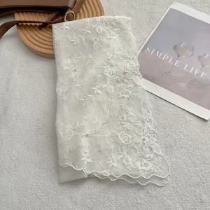 Elegant white lace scarf with floral embroidery and pearls for a minimalist fashion look