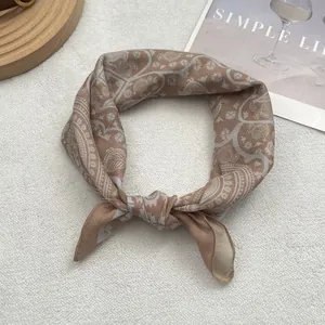 Retro Egyptian bird print square scarf in earth tones of brown and beige silk fabric