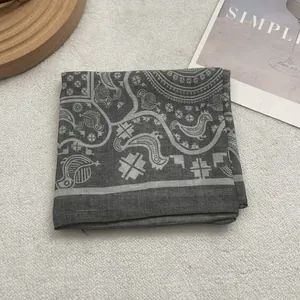 Detail of grey Egyptian motif cotton square scarf with bird and flower jacquard patterns